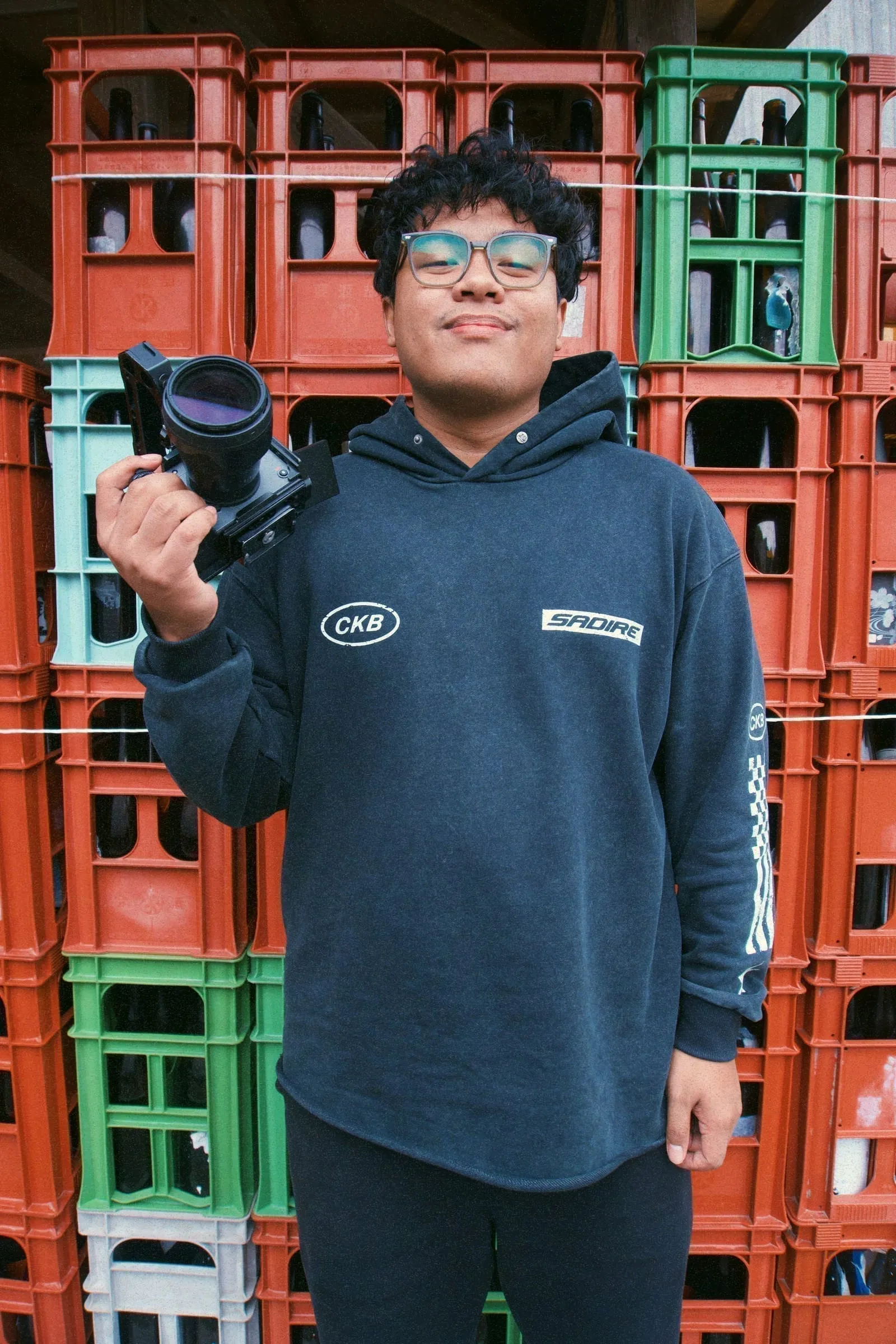 Gigi, the videographer behind Where Is Chef Jason, holding his cinema camera