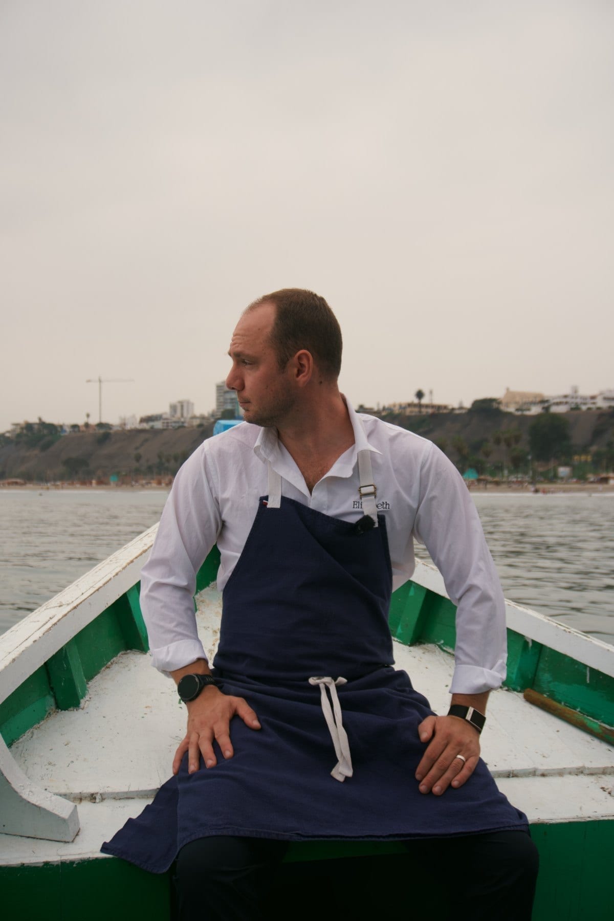 Jason in his Elizabeth whites on a fishing boat in Lima
