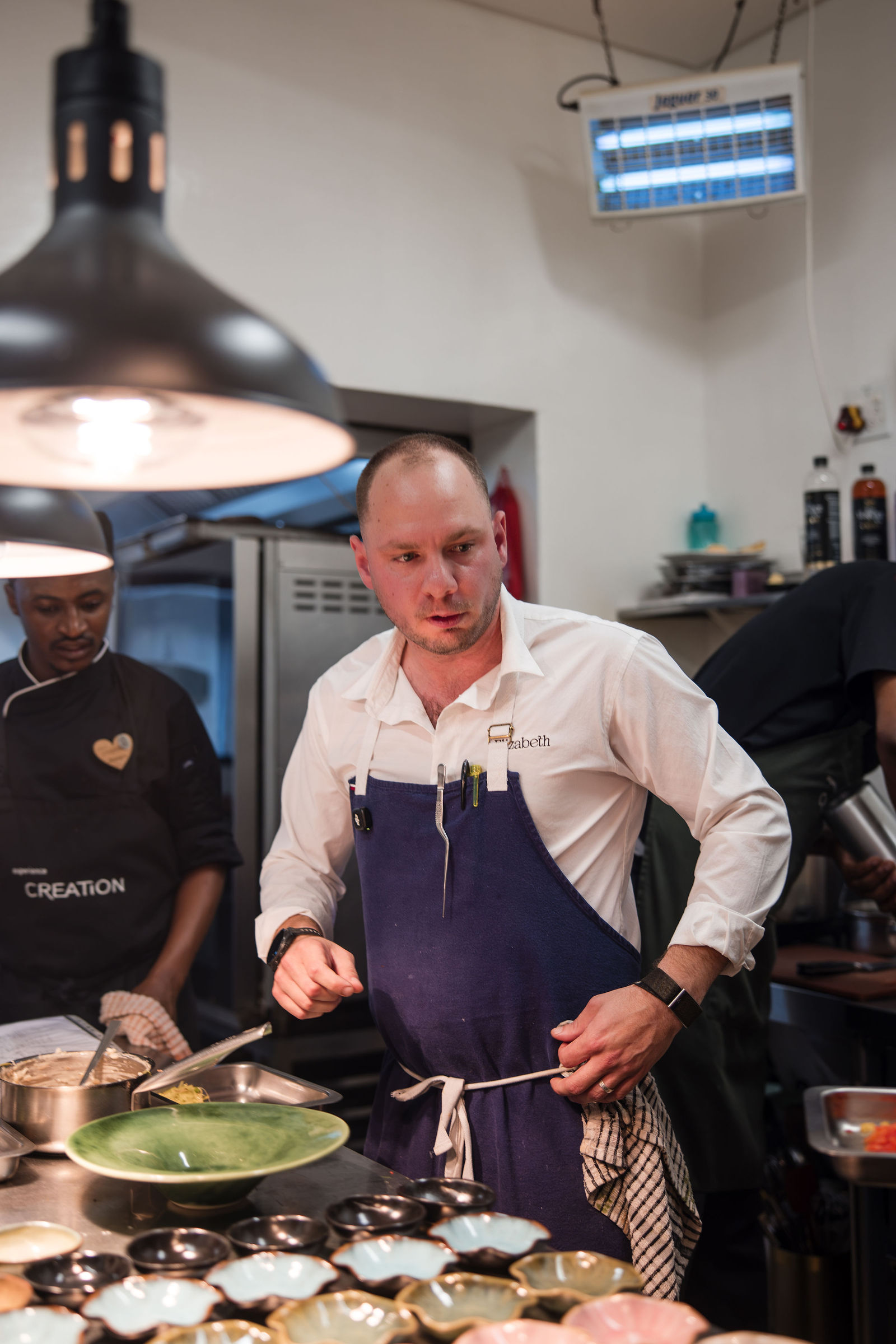 Chef Jason McKinney preparing dishes at Creation Wines