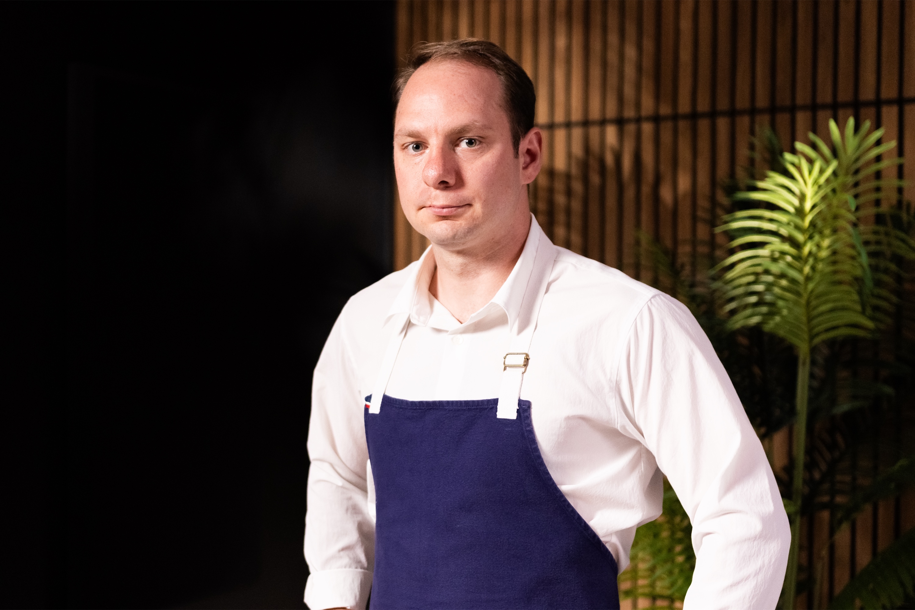 Chef Jason McKinney in a navy apron