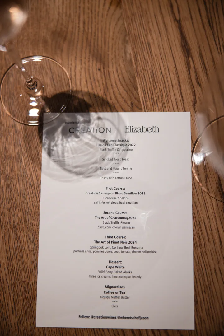 The printed Elizabeth menu beside a wine glass at Creation Wines