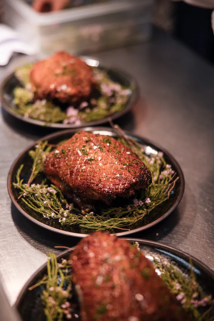 Roast ducks resting on herbs in the Creation Wines kitchen