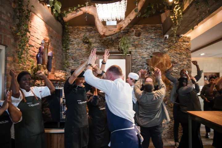 Jason and the Creation Wines team celebrating together after service