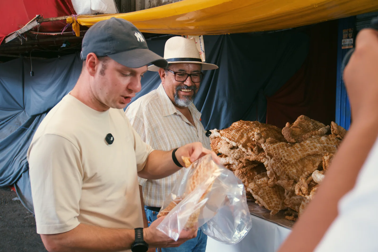 Jason tasting food at a Mexico City market